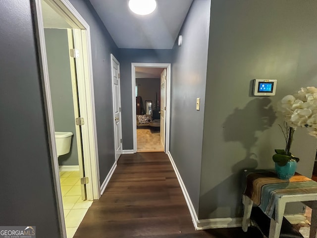 corridor featuring dark hardwood / wood-style floors