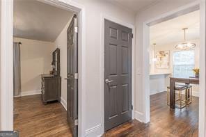 hallway featuring dark wood-type flooring