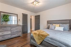 bedroom featuring dark hardwood / wood-style flooring