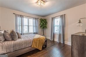 bedroom featuring dark hardwood / wood-style flooring