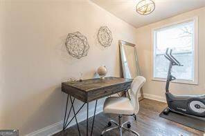 office area with dark hardwood / wood-style flooring