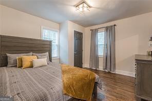 bedroom featuring dark hardwood / wood-style flooring