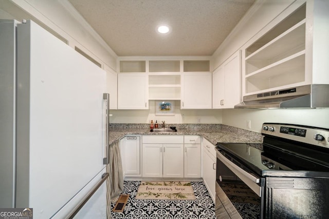 kitchen with white cabinets, white refrigerator, a textured ceiling, ventilation hood, and electric stove