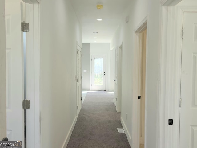 hallway featuring baseboards, carpet flooring, and recessed lighting