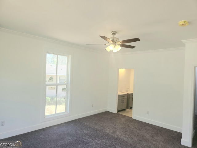 unfurnished bedroom featuring light carpet, baseboards, ornamental molding, and connected bathroom