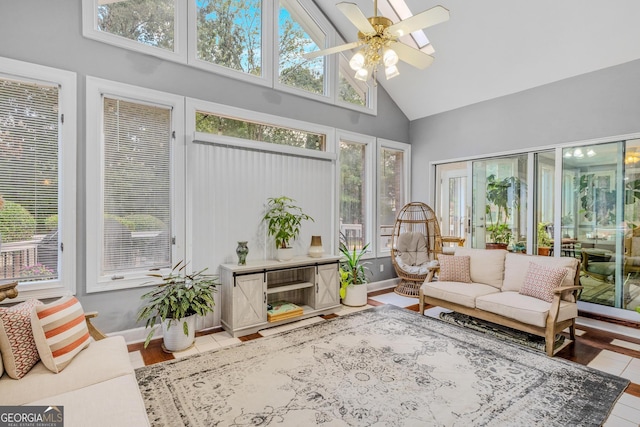 sunroom with lofted ceiling and ceiling fan