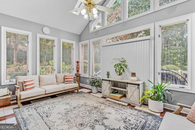 sunroom with a healthy amount of sunlight and ceiling fan