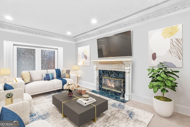 living room with crown molding, carpet, and a high end fireplace