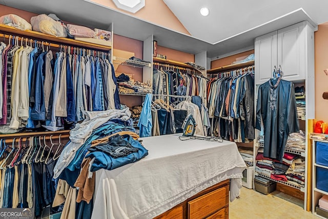 walk in closet featuring light tile patterned floors