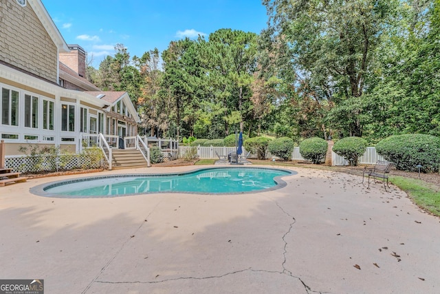 view of pool featuring a patio area