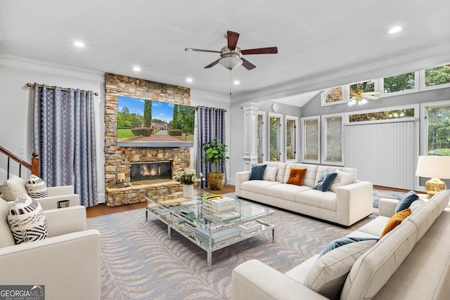 living room with ornamental molding, hardwood / wood-style floors, and ceiling fan