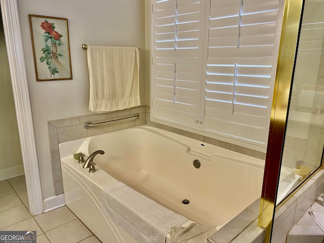 bathroom featuring separate shower and tub and tile patterned flooring