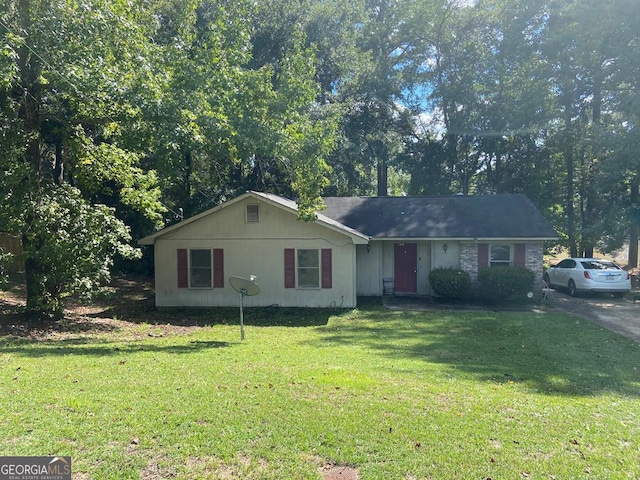 ranch-style house with a front yard