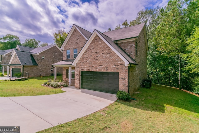 view of front of home featuring a garage and a front lawn