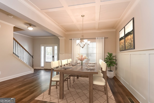 dining area with coffered ceiling, dark hardwood / wood-style floors, and crown molding