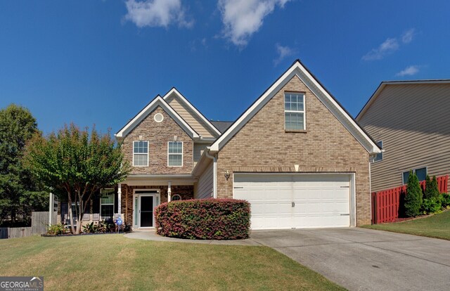 view of front facade with a front lawn and a garage