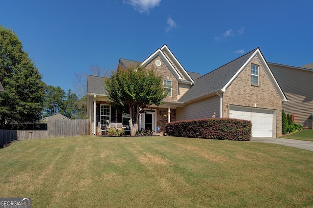 view of front of property featuring a garage and a front lawn