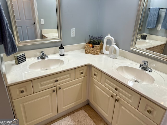 bathroom with tile patterned flooring and vanity