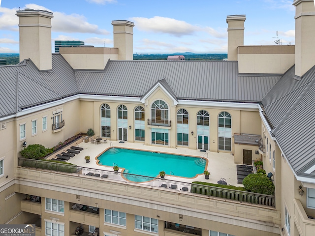 view of swimming pool with a patio area