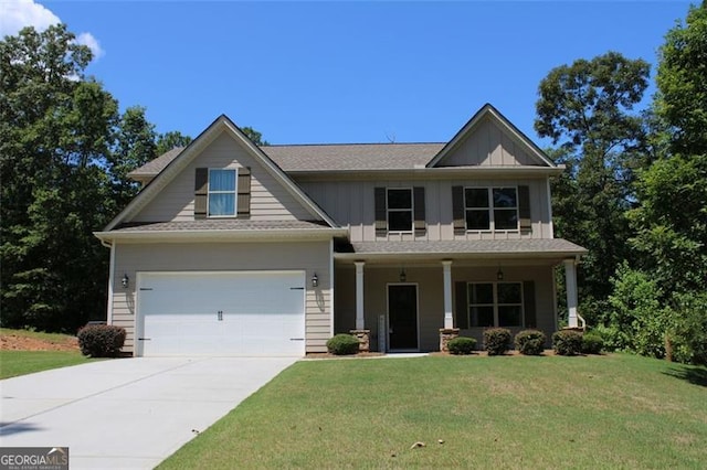 craftsman inspired home with a garage, a porch, and a front lawn