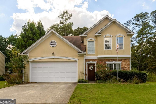 view of front of property featuring a front yard and a garage