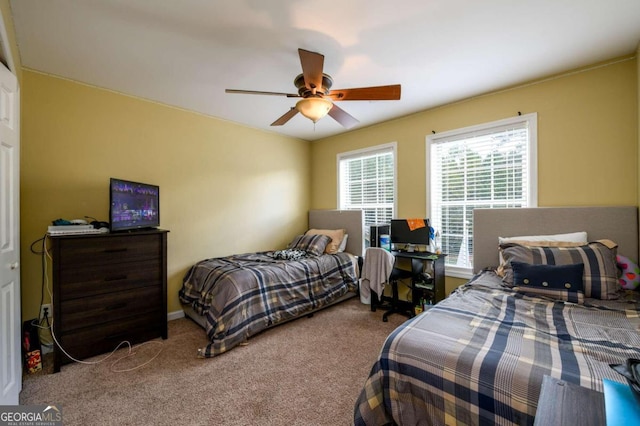 carpeted bedroom with ceiling fan