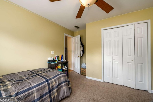 bedroom with carpet flooring, ceiling fan, and a closet