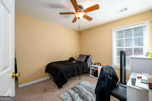 carpeted bedroom featuring ceiling fan