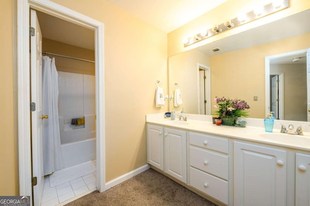 bathroom with vanity, shower / bathtub combination with curtain, and tile patterned floors