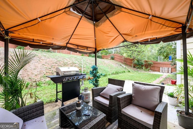 view of patio / terrace with outdoor lounge area, a gazebo, and a grill