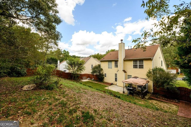 rear view of property featuring a patio