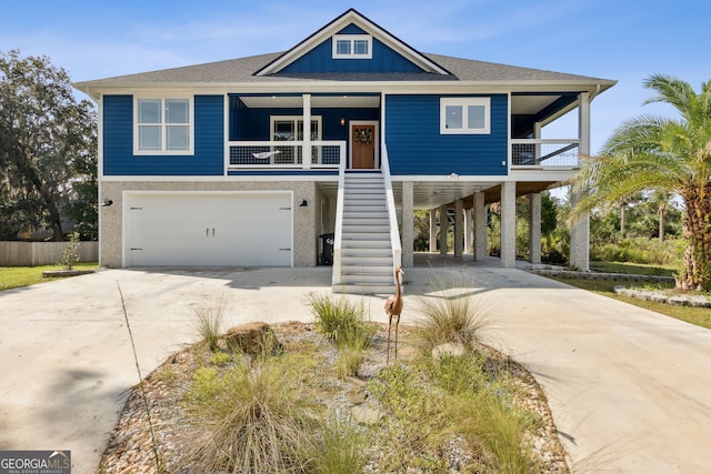 view of front of home with a garage and covered porch