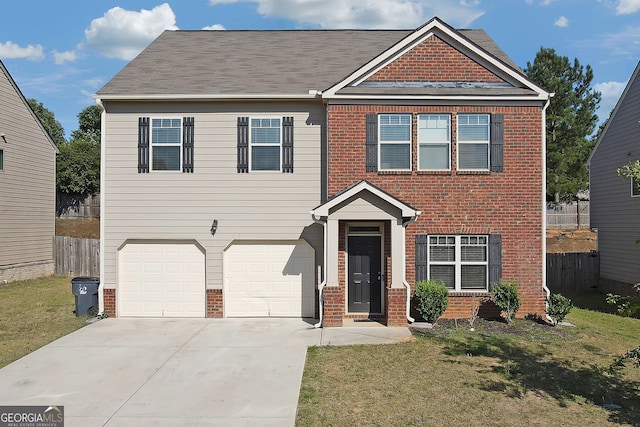 view of front of house featuring a garage and a front yard