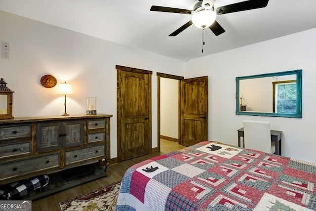 bedroom featuring dark hardwood / wood-style floors and ceiling fan