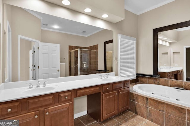 bathroom with crown molding, independent shower and bath, and vanity