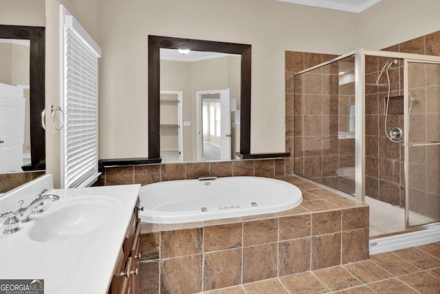 bathroom with crown molding, vanity, and separate shower and tub