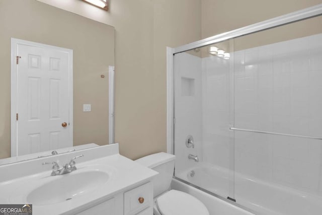 full bathroom with shower / bath combination with glass door, toilet, and vanity