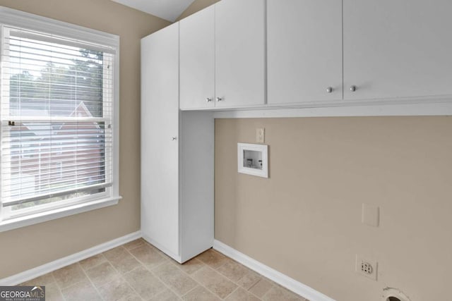 washroom featuring cabinets, electric dryer hookup, and washer hookup