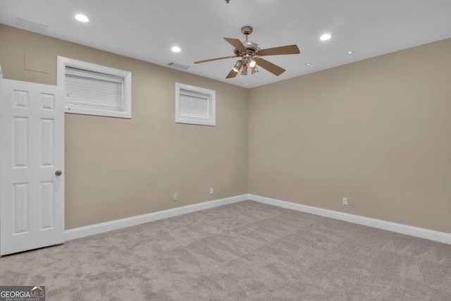 unfurnished room with light carpet and ceiling fan