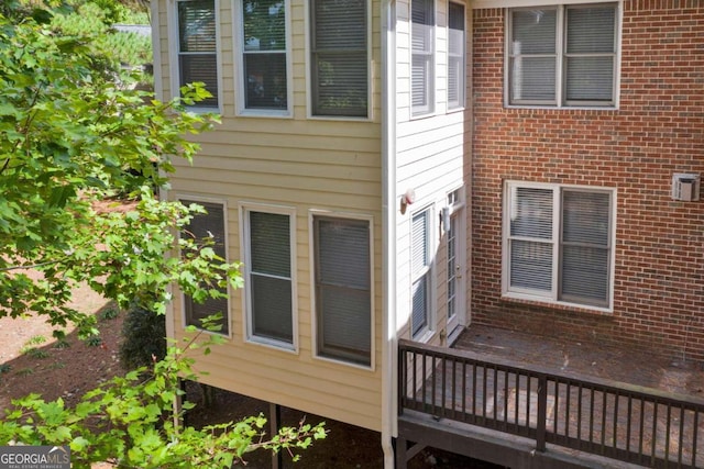 view of side of home with a deck