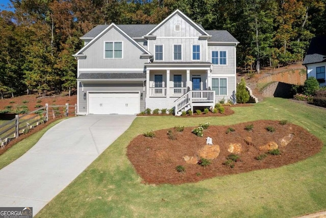 craftsman house with a garage, a front lawn, and a porch