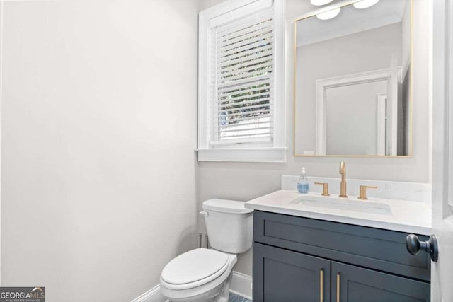 bathroom with vanity and toilet