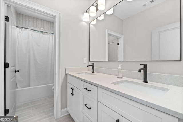 full bathroom featuring vanity, toilet, and shower / bathtub combination with curtain