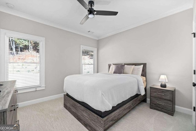 bedroom featuring multiple windows, light carpet, and ceiling fan