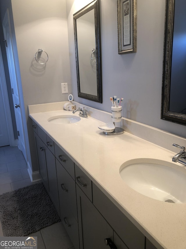 bathroom with tile patterned flooring and vanity