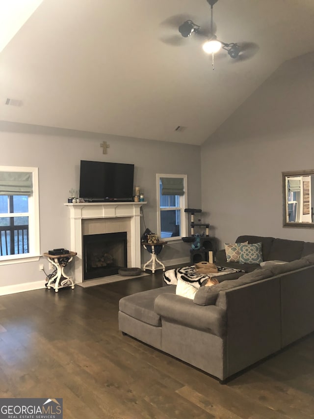 living room with high vaulted ceiling, wood-type flooring, ceiling fan, and a fireplace