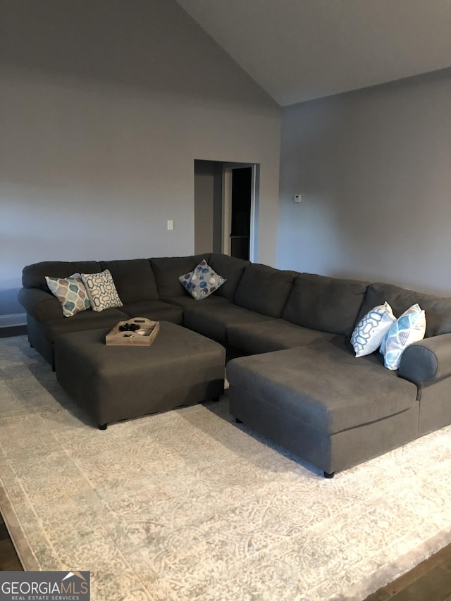 living room featuring vaulted ceiling