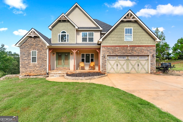 craftsman-style home with a garage, a front lawn, and covered porch