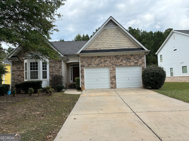 view of front of house featuring a front yard and a garage