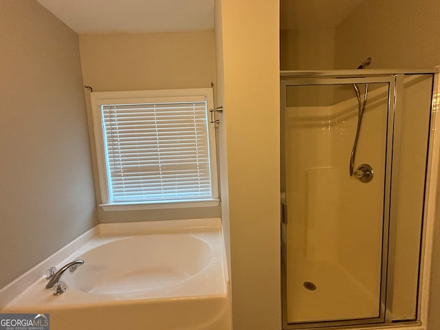 bathroom featuring plus walk in shower